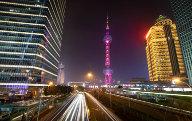 Fototapeta na wymiar A night view of the modern Pudong skyline across the Bund in Shanghai, China.