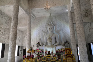 White buddha inside temple. Chiang Rai. Thailand.