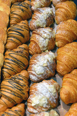 croissants on a shelf pastry shop