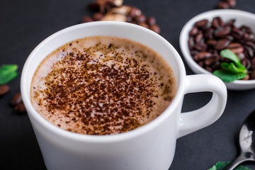 Mushroom Chaga Coffee Superfood Trend-dry and fresh mushrooms and coffee beans on dark background with mint. Close up
