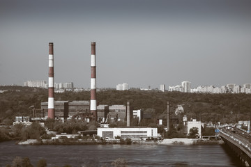 factory and pipes near the river