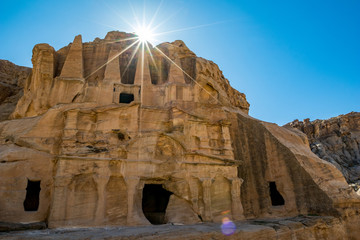 Petra, Jordan. Stunning sunlight rays, light diffraction effect over the Obelisk Tomb or Bab As Siq...