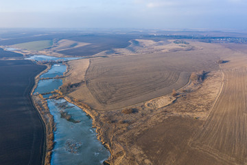 Dams on the river. Crossing the river. Drone above lake