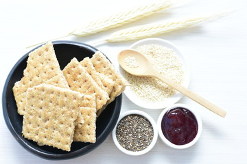 Healthy sesame biscuits (Sesamum indicum), whole grain cereal and jam
