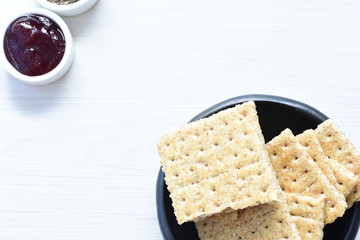 Healthy sesame biscuits (Sesamum indicum), whole grain cereal and jam