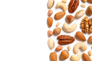 Different delicious nuts on white background, flat lay. Space for text