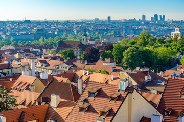 Top view to red roofs and green trees skyline of Prague city Czech republic.