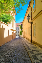 View to the street in the old center of Prague - the capital and largest city of the Czech Republic - travel background
