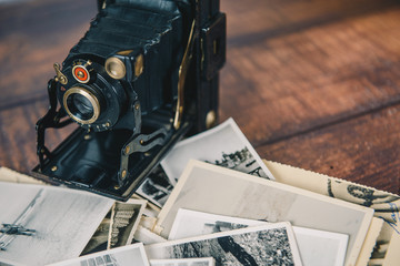 Old camera and photographs closeup