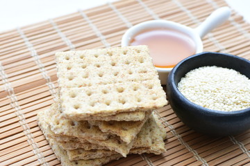 Healthy sesame biscuits (Sesamum indicum) healthy whole grain honey cereal and coffee cup