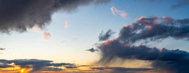 Fantastic dark thunderclouds at sunrise