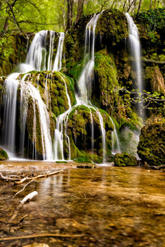 Long exposure of a beautiful waterfall with green moss, Beusnita, Cheile Nerei National Park, Romania