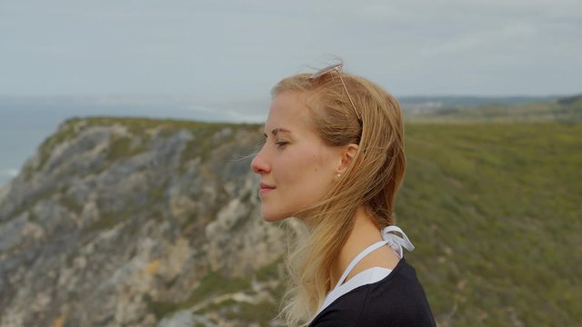 Young woman at the Natural Park of Sintra at Cabo da Roca - travel photography