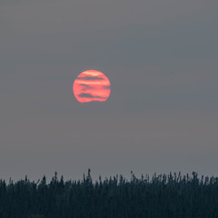 close up of the sun at dusk. sun with clouds