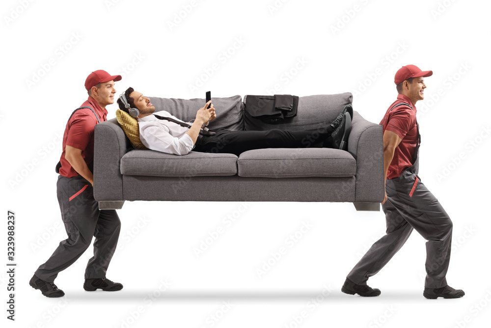 Wall mural two movers carrying a man with headphones on a sofa