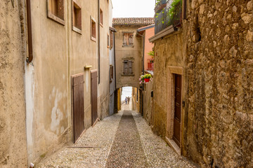 Fototapeta na wymiar Picturesque small town street view in Malchesine, Lake Garda Italy.