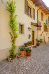 Fototapeta na wymiar Entrance of an old apartment building in Limone, Garda, Italy.