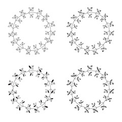 A wreath of leaves and twigs. Set of black and white vector round floral frames isolated on white background.