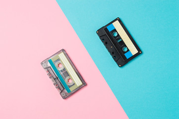Fototapeta premium Retro audio cassette tapes on colorful background. Vintage music technology concept.