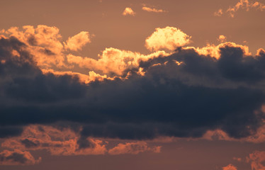 close up of the sun at dusk. sun with clouds at sunset