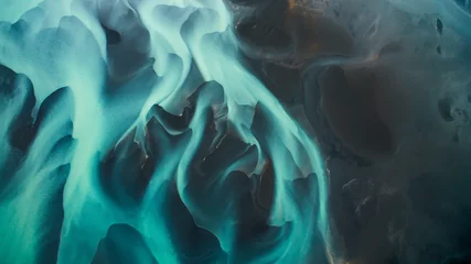 Foto auf Acrylglas Aerial view from above on a green and blue glacier river stream in  South Iceland. Beautiful patterns, textures and structures. Melting glacier,  Global warming and climate change concept © eVEN
