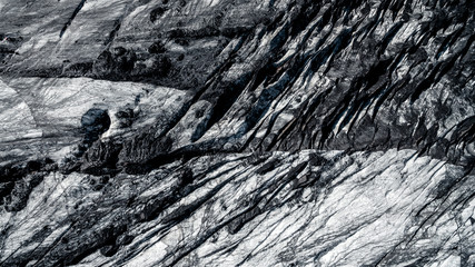 Drone, Top view. Skaftafell National Park. Ice and ashes of the volcano texture landscape, beautiful nature ice background from Iceland. Sólheimajökull glacier.