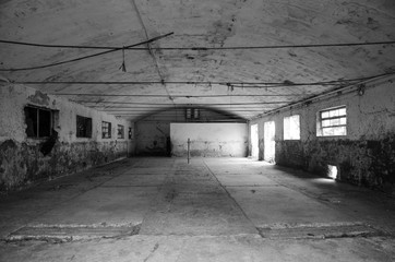 Image of an empty and abandoned stable of an old farm