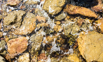 river with a stream and pebbles.pebbles at the bottom of the river