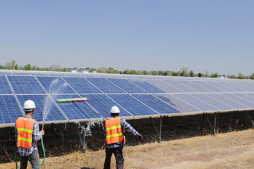 Employees or technicians to clean solar cells in a solar plant.