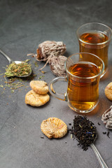 cups of tea and dried fruits, tea leaves