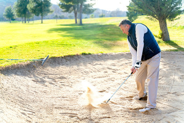 Senior playing golf on a golf course