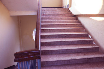 Staircase with wood railing.Stairs in a modern College University building.Luxury custom built home...