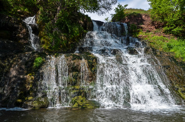 Obraz premium Dzhurynskyi or the Chervonohorodskyi waterfall. It is the largest in Ukraine plain waterfall. Spring landscape. Local natural landmark. Nyrkiv, Ternopil region, Ukraine