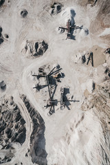 Aerial drone view of huge mine pit with moonlike appearance.