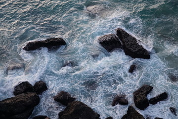 waves crashing on rocks