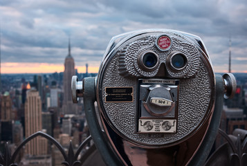 binoculars in front of manhattan