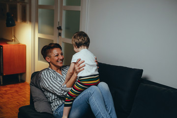 mother enjoying time with her little son at home