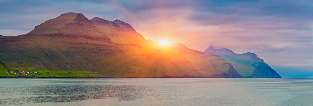 Sunrise Over Kalsoy Island, View On Husar Village and Luteran Church, located on the island of Kalsoy, Faroe Islands