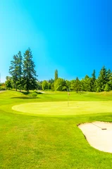 Gordijnen Golf course with gorgeous green and sand bunker © karamysh