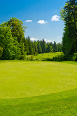 Fototapeta na wymiar Golf place with gorgeous green and sand bunker.