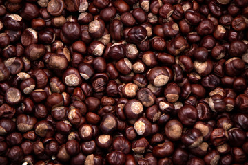 Top view heap of chestnuts. Pile of ripe chestnuts for food background
