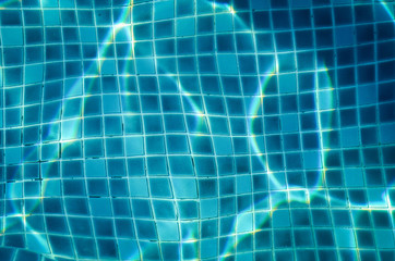 blue water of swimming pool , blue background concept