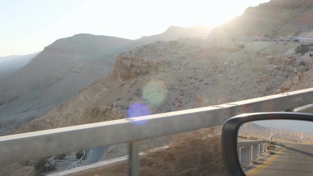 POV view of Driving trip through the rock hills surrounding in South Israel Central Negev to explore the Negev Desert Machtesh HaGadol Yerucham Big gigantic Crater.  AMAZING views of the Israel.