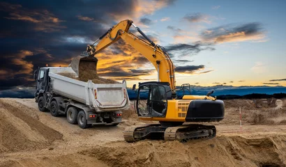 Fotobehang Vrachtwagen excavator at construction site  © Wolfilser