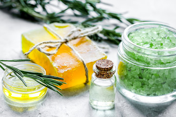 organic cosmetics with rosemary extract on stone table background