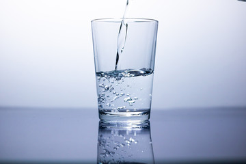 a glass fill with water and bubbles