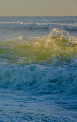 Obraz na płótnie Canvas Huge wave backlit from the sun. Rough sea