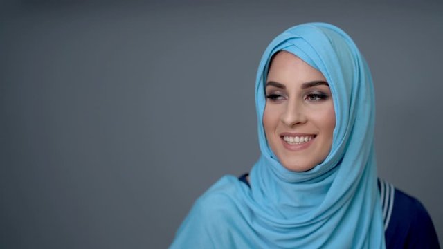 Female muslim student learning at home