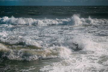waves on the sea beach on a sunny day