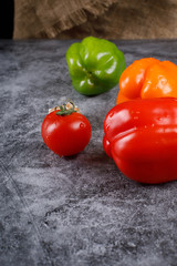 Color bell peppers on a blue background.